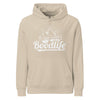Sudadera con capucha Del Pirineo Al Mundo de Boodlife en beige, con el lema y las montañas estampados en blanco (versión Day)